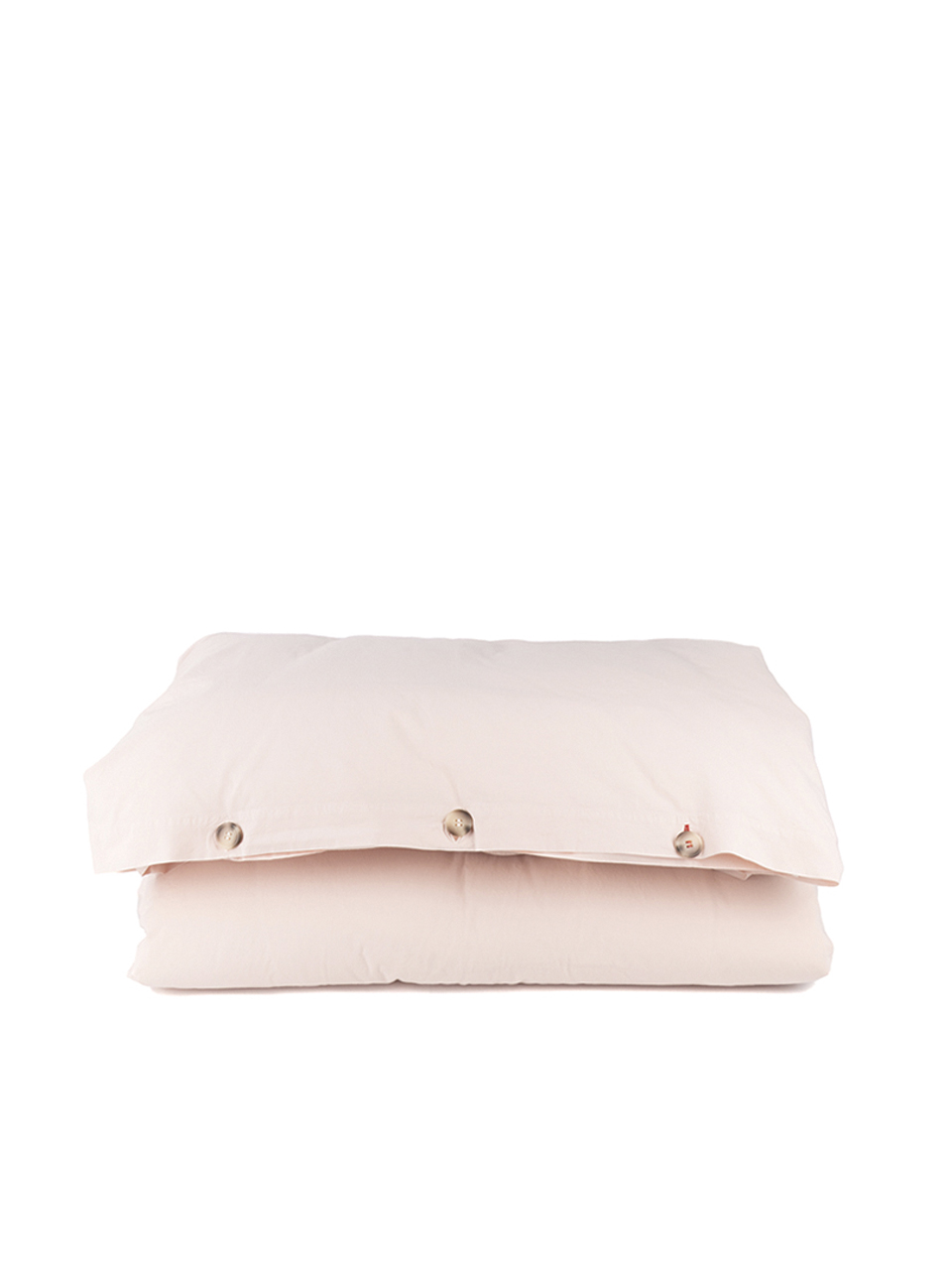Housse de couette beige avec boutons visibles.