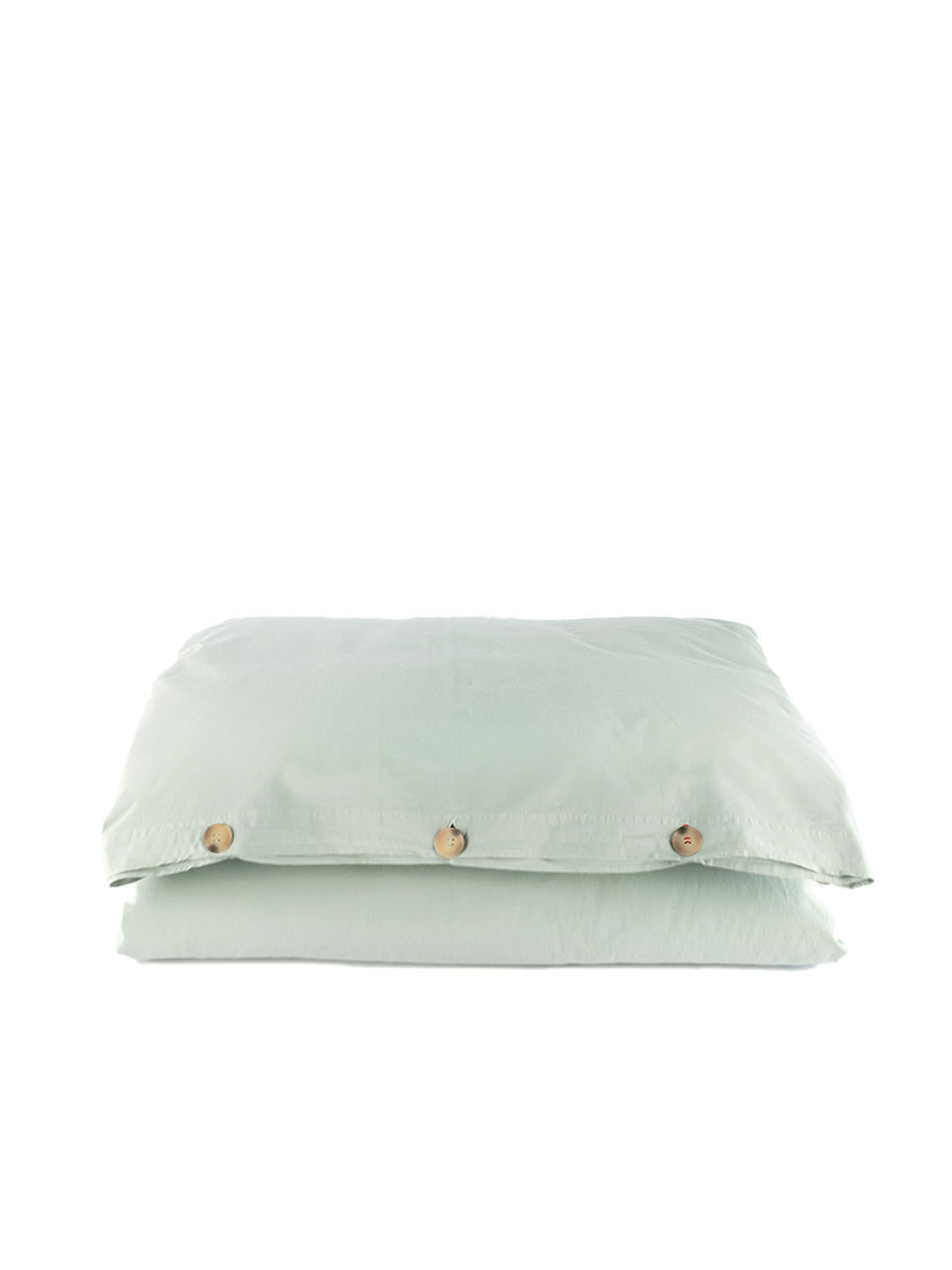 Drap housse vert pâle avec boutons visibles.